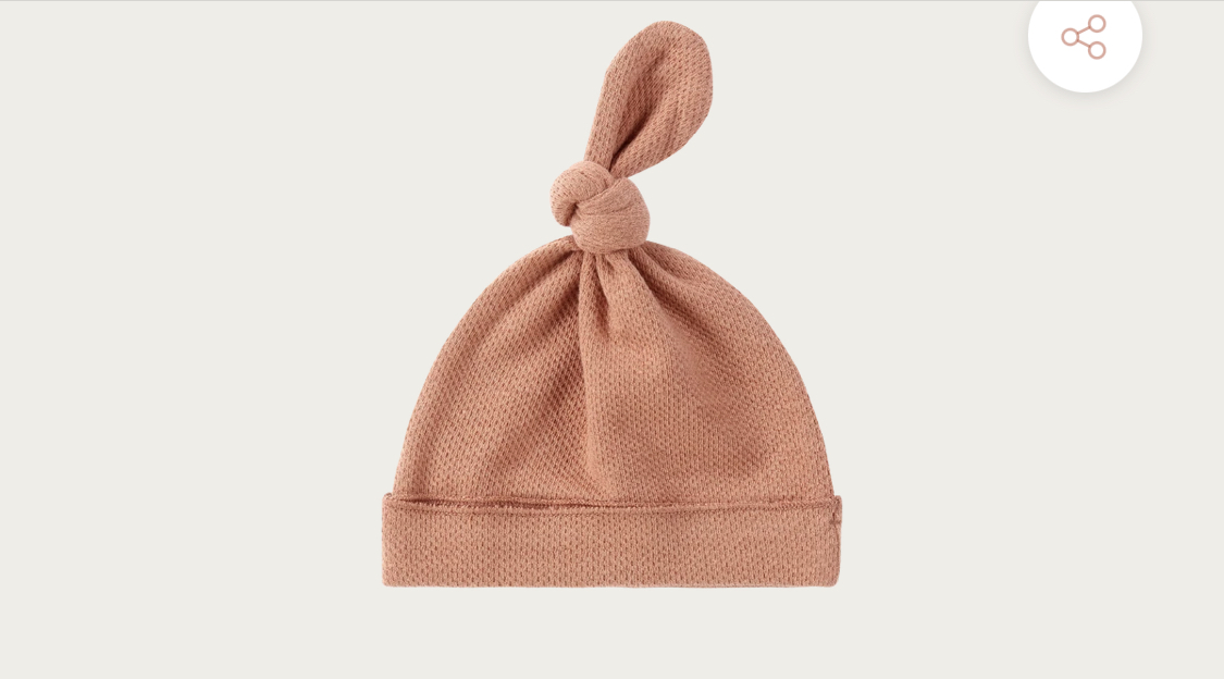 ORGANIC KNOTTED HAT. TERRACOTTA (POINTELLE)