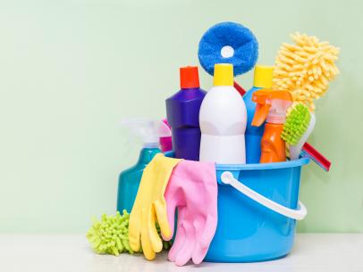 Bucket of household cleaning supplies